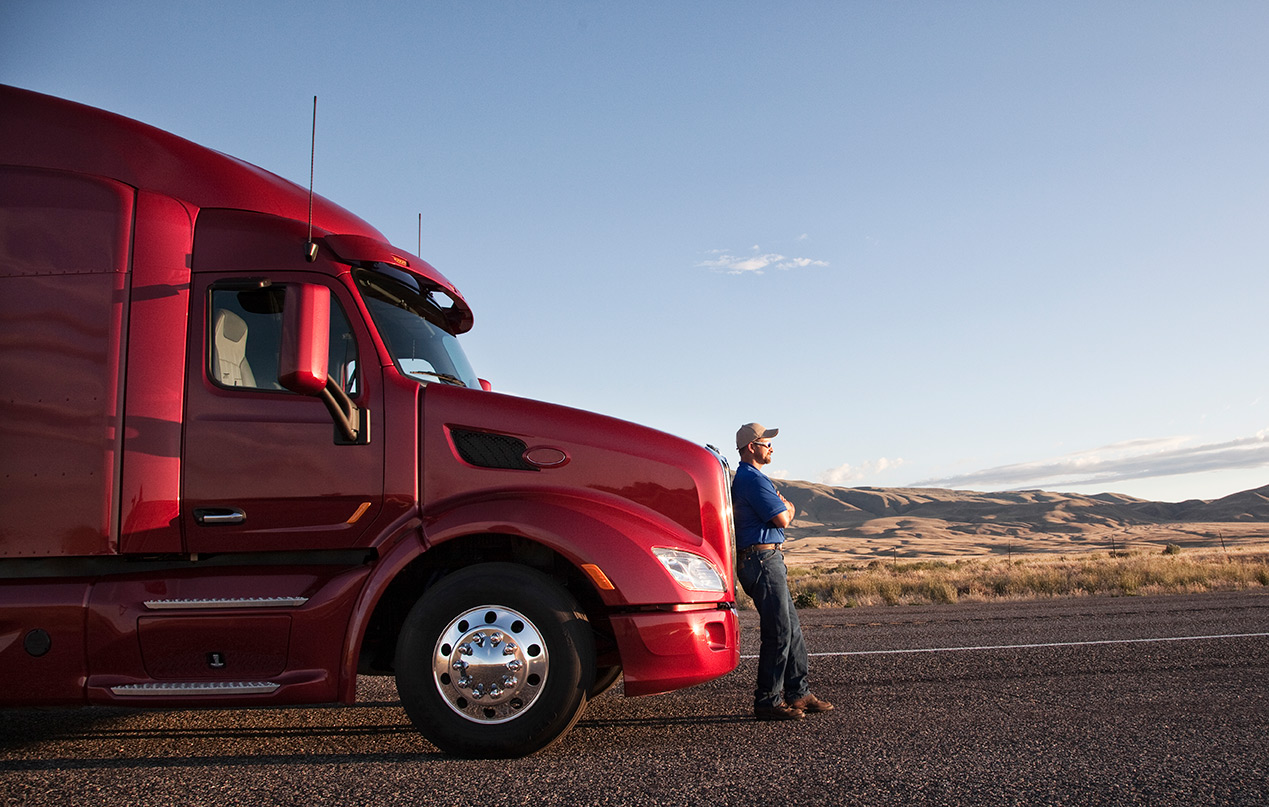Nordac Trans Inc driver beside his assigned tractor